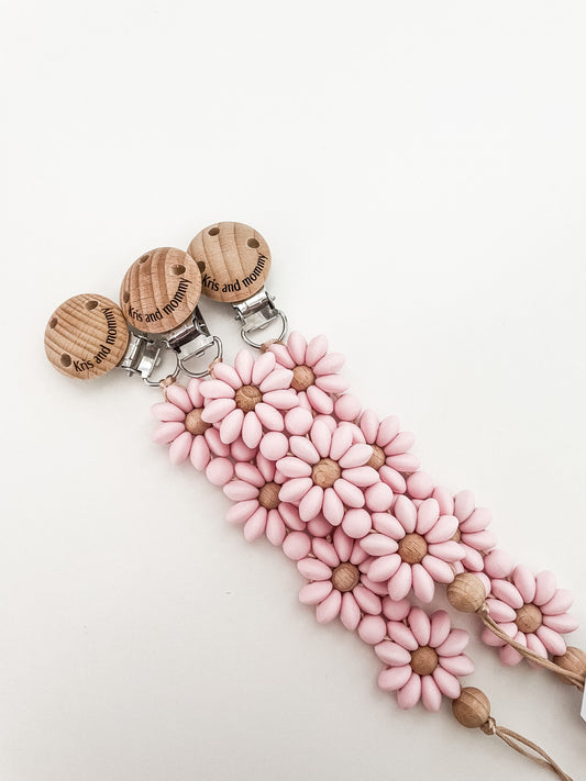 Priponka za dudo Daisy iz silikonskih perlic v obliki rože, varna in nežna za dojenčke.