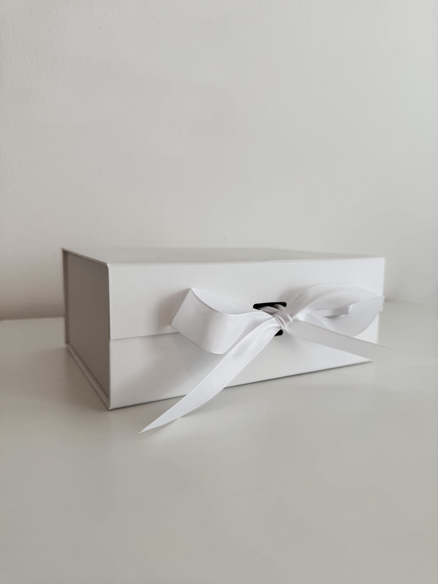 White gift box with ribbon