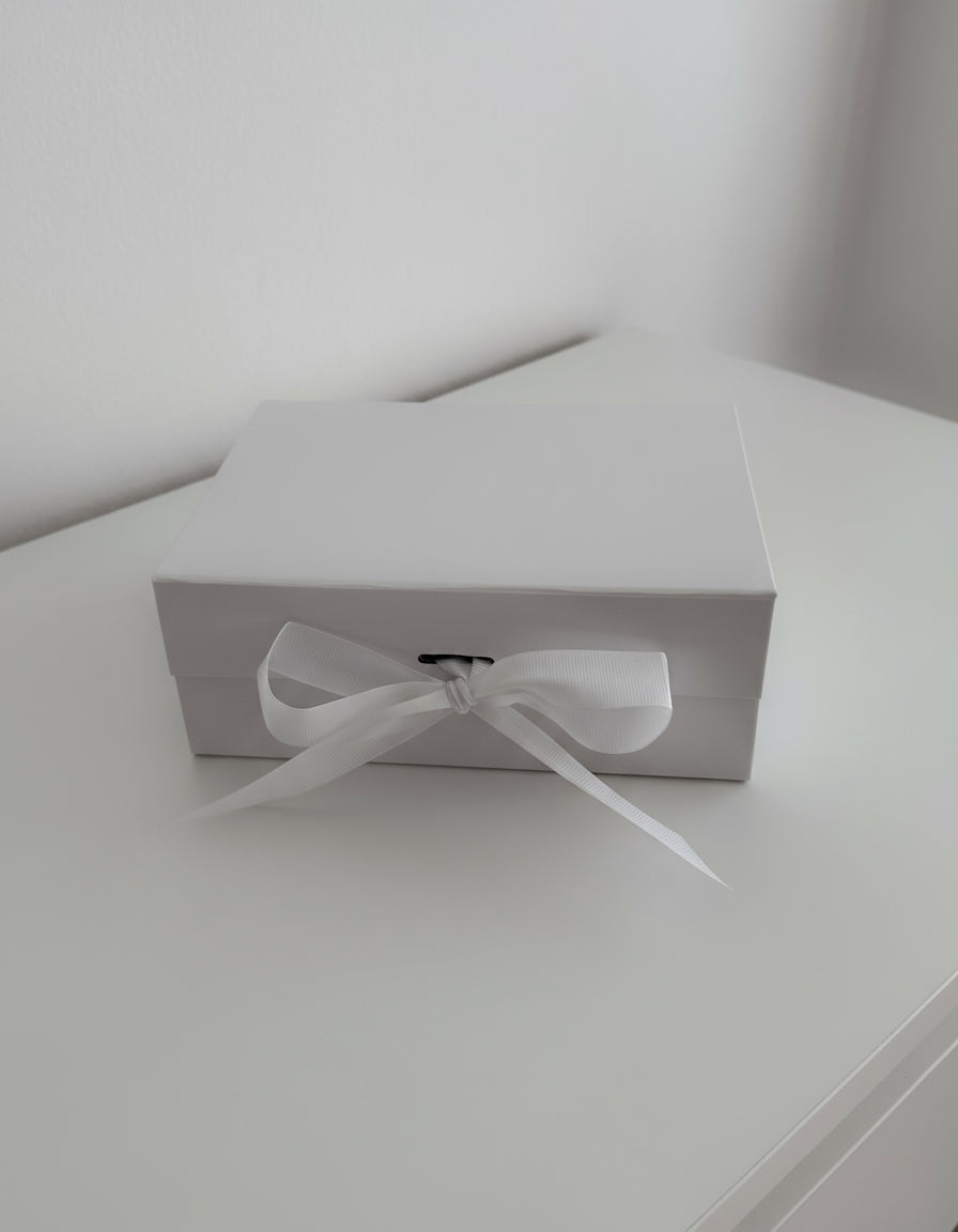 White gift box with ribbon