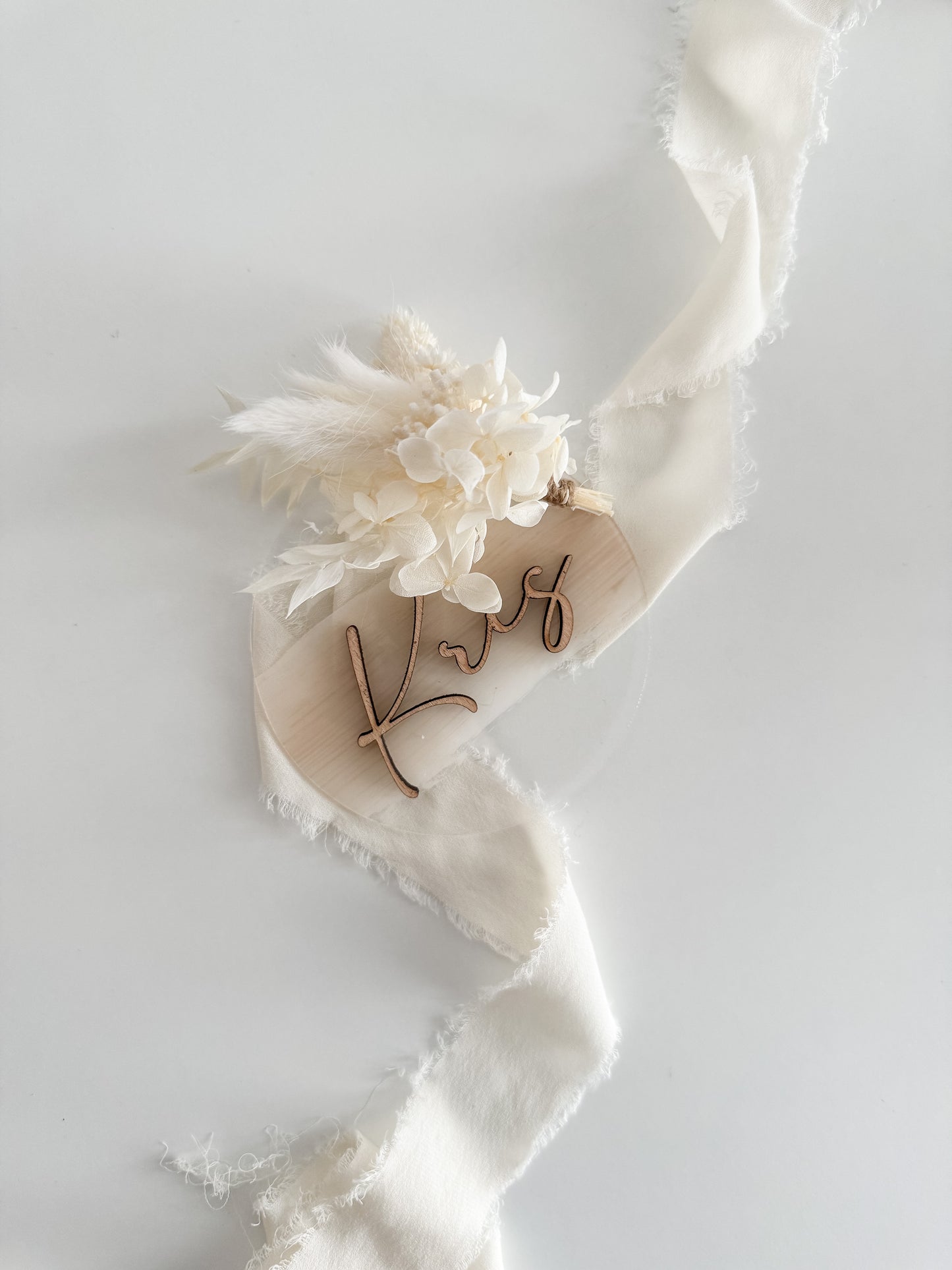 Announcement card with name and dried bouquet