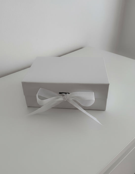 White gift box with ribbon
